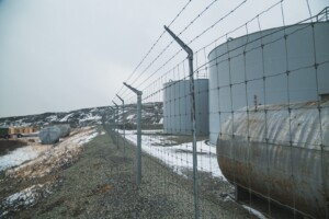 The tank farm—a collection of giant diesel reservoirs and generators—is how the people of Inukjuak currently get their electricity. Described as an eye-sore, the community hopes to phase these out eventually, only keeping the generators as a backup as they move towards more sustainable hydroelectricity through the Innavik Hydro Project. The tank farm—a collection of giant diesel reservoirs and generators—is how the people of Inukjuak currently get their electricity. Described as an eye-sore, the community hopes to phase these out eventually, only keeping the generators as a backup as they move towards more sustainable hydroelectricity through the Innavik Hydro Project.