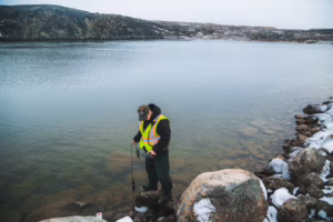 Every day, Eric Atagotaaluk tests the water downstream from the construction site. Here he checks the turbidity, temperature and pH of the water. The results of this test showed that the water quality was at normal levels. Every day, Eric Atagotaaluk tests the water downstream from the construction site. Here he checks the turbidity, temperature and pH of the water. The results of this test showed that the water quality was at normal levels.
